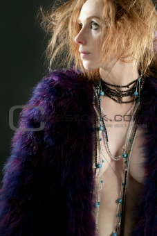 Beautiful sexy redhead woman, coat and jewelry