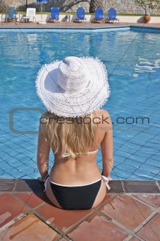 Young blond woman at swimming pool