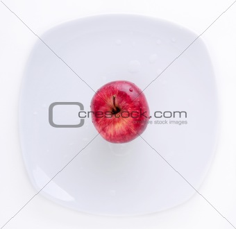Red Apple in the white plate
