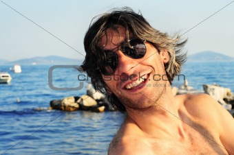 Young Man Smiling on the Sea