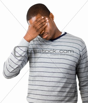 Stressed man with hand on his forehead