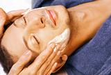 Man gets cream massage on face