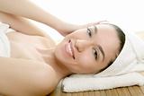 Beautiful woman face massage with white towel