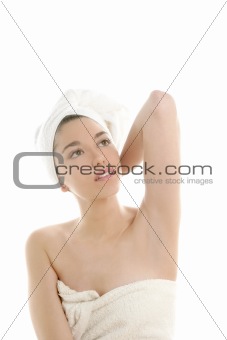 Beautiful woman with bath towel on white