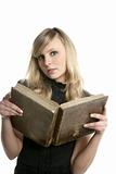 Blond beautiful student woman reading old book