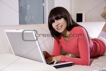 Woman on couch with computer