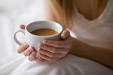 Woman's Hands Holding Cup of Coffee