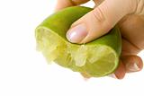 Hand squeezing green lime