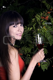 Woman outside with red drink