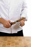 Chef - man sharpening knife
