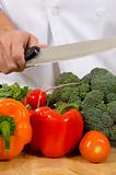 Fresh vegetables on cutting board with knife