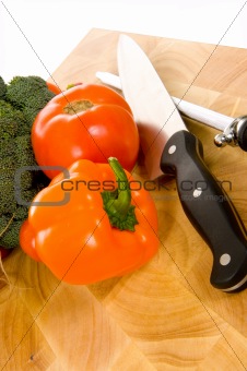 Fresh vegetables on cutting board with knife