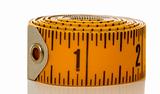 Closeup of tape measure on white backround