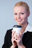 Business woman holding a coffee cup