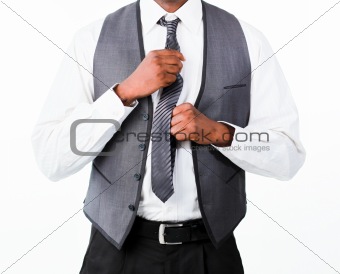 Businessman correcting tie