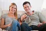 Young couple watching television