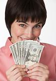 Beautiful brunette holding a stack of cash