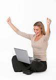 Young woman with laptop cheering