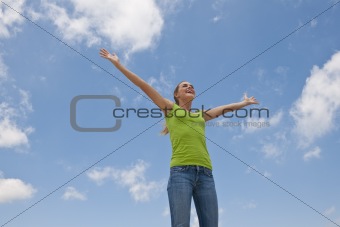 Smiling female posing with outstretched arms
