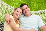 Young couple relaxing in a hammock