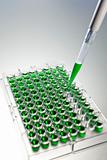 Pipette and Cell Tray full of Green Solution