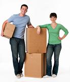 Couple standing next to moving boxes