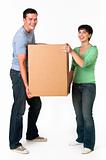 Cute couple moving a box together