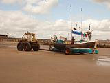 tractor towing fishing boat