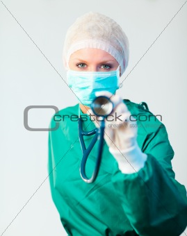 Surgeon holding stethescope outwards 