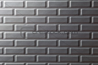 Wall of metallic bricks