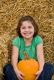 Girl Holding a Pumpkin