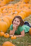 Young Girl in a Pumpkin Patch