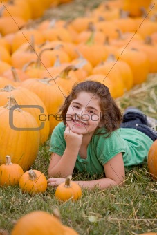 Young Girl in a Pumpkin Patch
