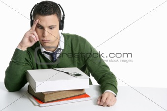 Young student boy with books on desk