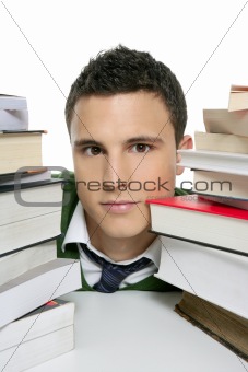 Young unhappy student with stacked books