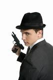 Classic mafia portrait, man with black suit and gun
