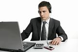 Businessman with laptop hearing mp3 music