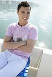 Young handsome man relaxed on his boat