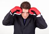 businessman with boxing gloves to his head