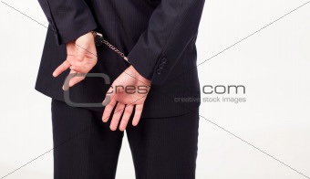 Businessman in hand cuffs