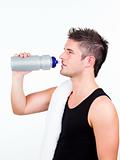 athlethic young man holding a sports bottle