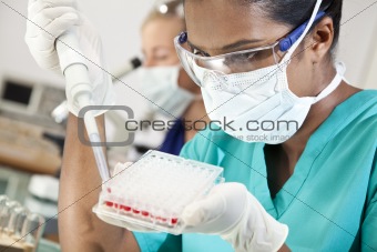 Asian Female Doctor Or Scientist In Laboratory With Blood Sample