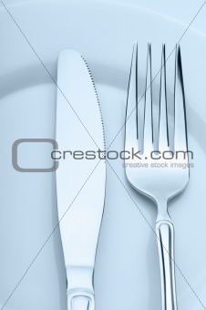 Knife and fork on a plate