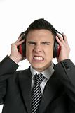 Businessman protecting from noise with headphones