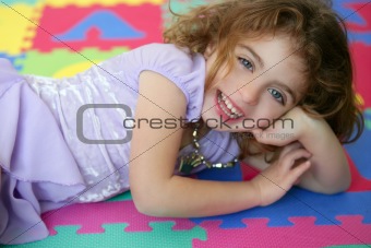 Beautiful princess little girl smiling lying floor
