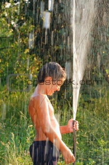 boy playing with water
