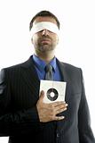 Blindfolded businessman with target over white