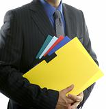 Businessman and color folders over white