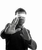 Blindfolded businessman over white background