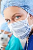 Beautiful Female DoctorIn Sutgical Scrubs and Mask